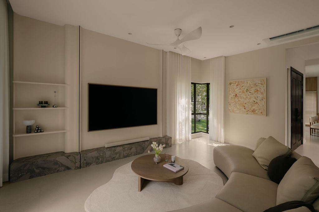 The living area, with an abstract artwork sourced by the client on the side wall