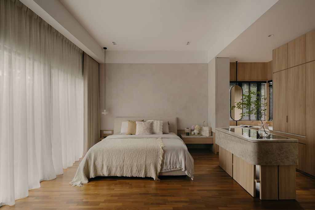 The master bedroom, with a King Living bed frame, timber flooring, and sheer curtains along the full window