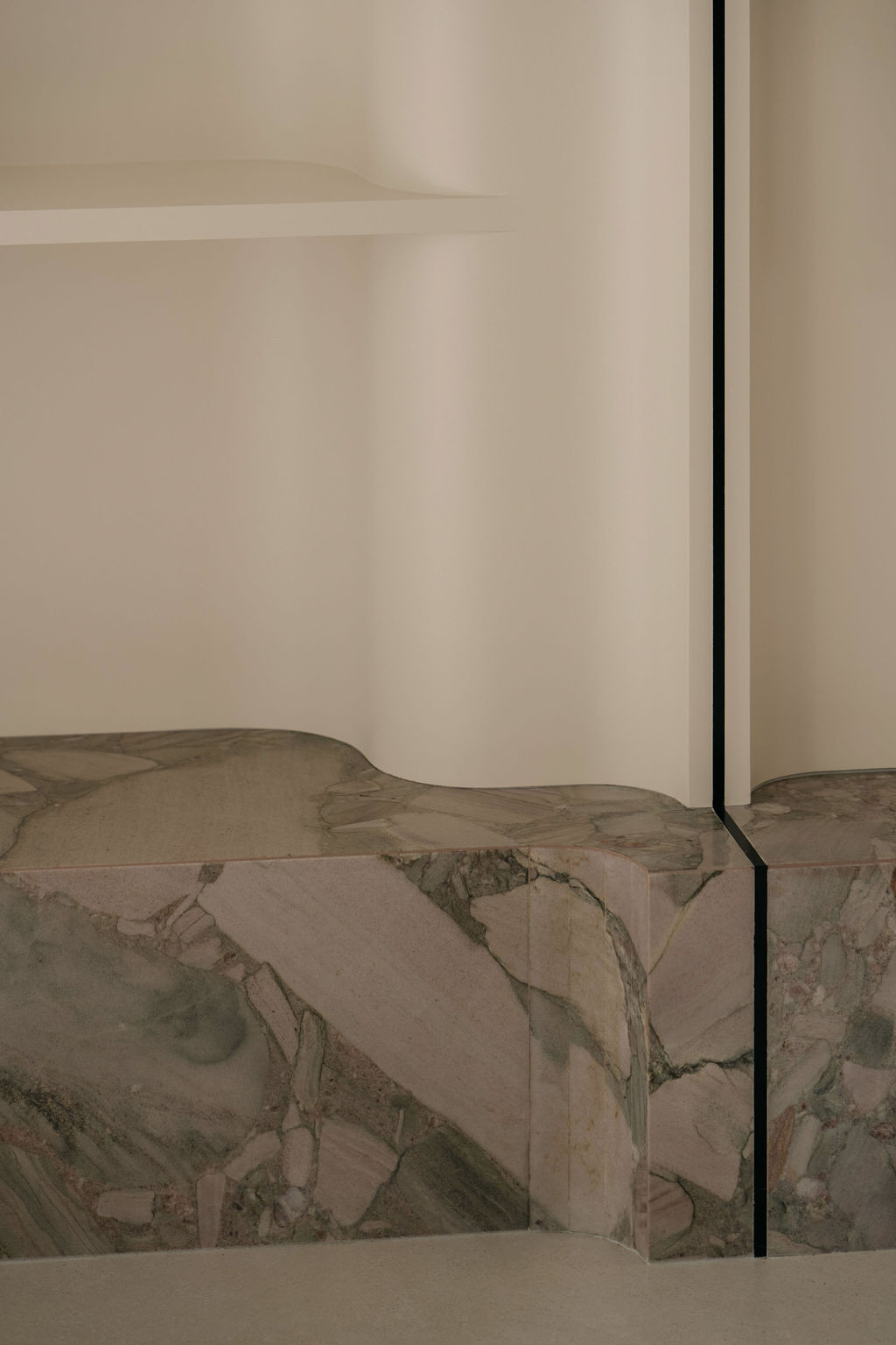 A detail of the Palladium Sage quartzite used on the TV cabinet base, sourced from Stonedeart