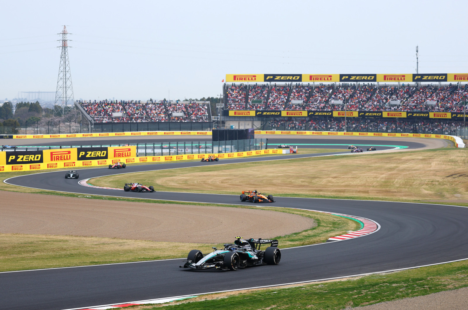 SUZUKA, JAPAN - MARCH 29: Andrea Kimi Antonelli of Italy driving the (12) Mercedes AMG Petronas F1 Team W17 leads Oscar Piastri of Australia driving the (81) McLaren MCL40 Mercedes and Lewis Hamilton of Great Britain driving the (44) Scuderia Ferrari SF-26 on track during the F1 Grand Prix of Japan at Suzuka Circuit on March 29, 2026 in Suzuka, Japan. (Photo by Clive Rose - Formula 1/Formula 1 via Getty Images)