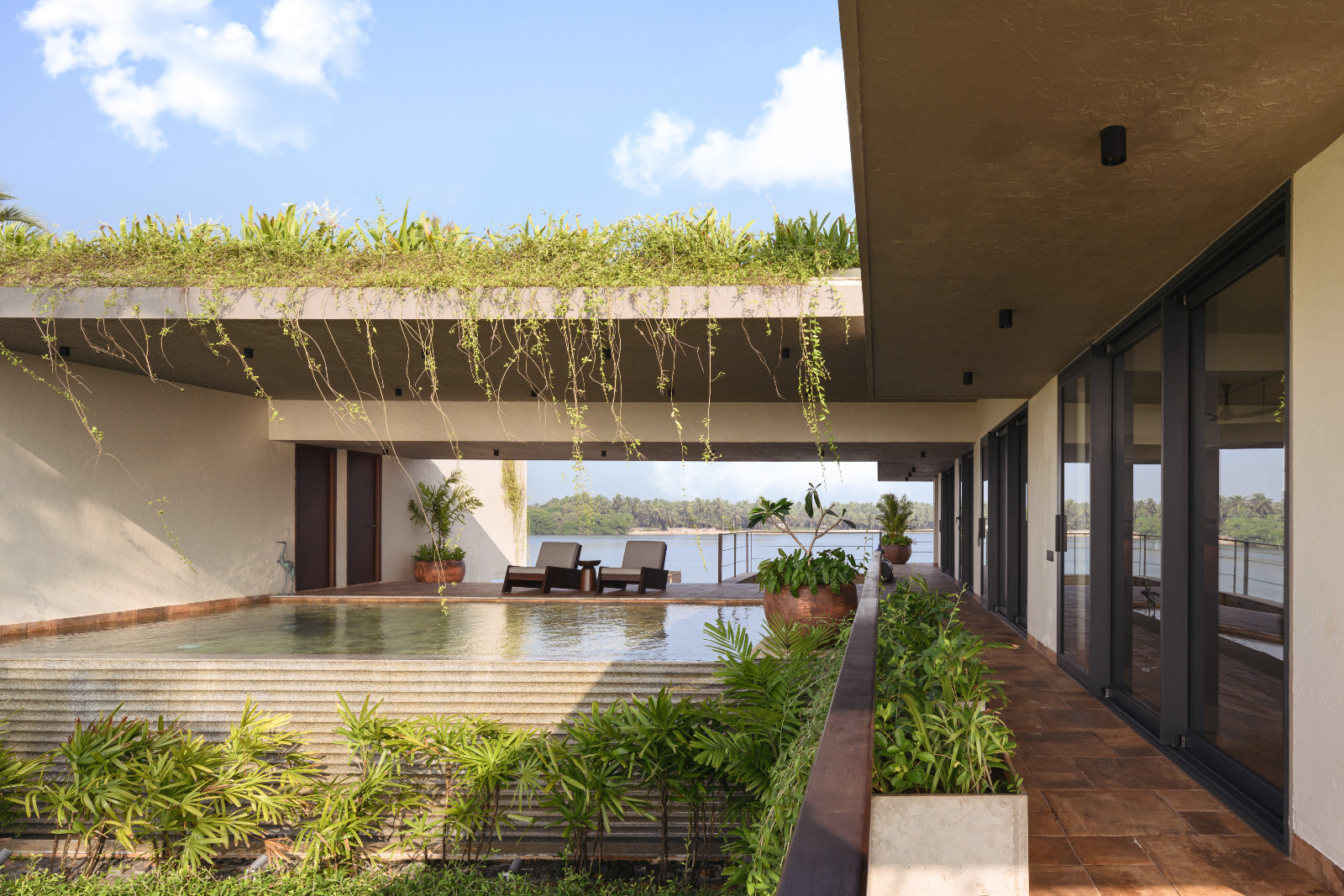 A tranquil flow between the indoors and the outdoors in a Karnataka, India home designed by Thomas Parambil Architects