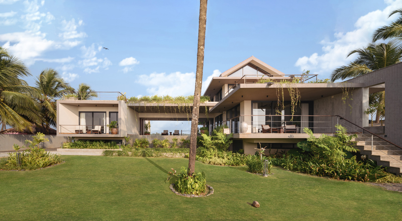 The garden area overlooking the sea in a Karnataka, India home designed by Thomas Parambil Architects