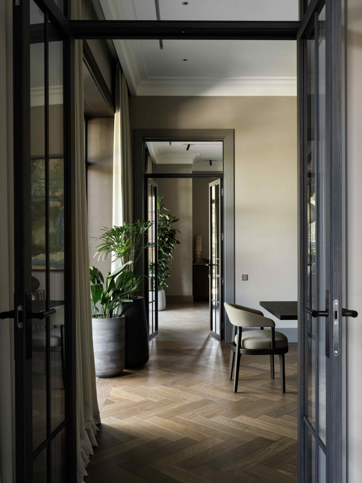 Daylight filters through glass doors and expansive windows