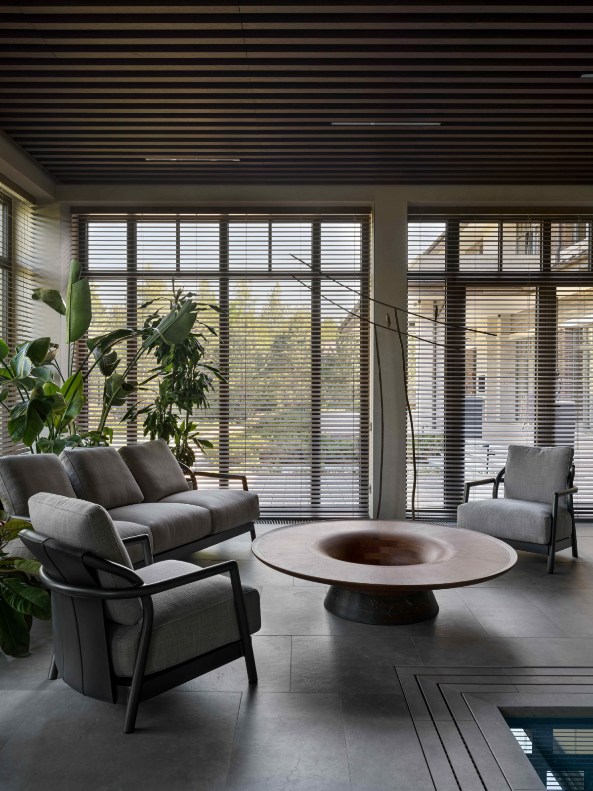 Flexform armchair adheres to the home’s restrained aesthetic