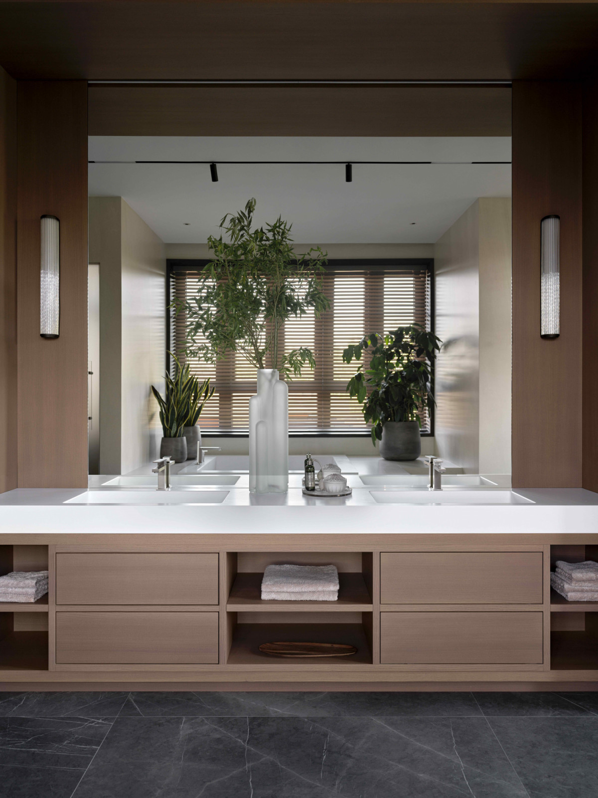 The well-appointed master bathroom is particularly serene