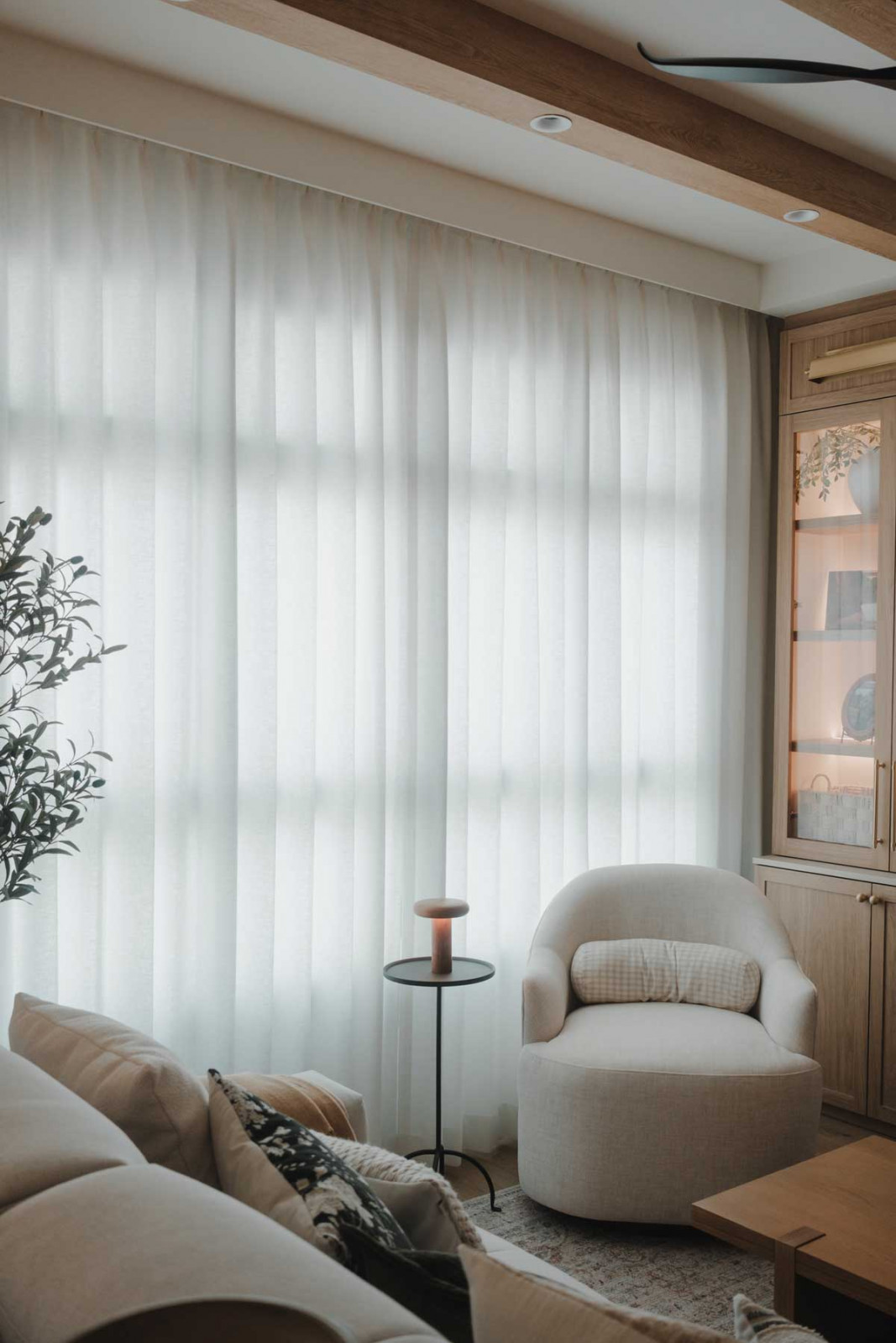 Pleated Lucent curtains give this space a polished appearance