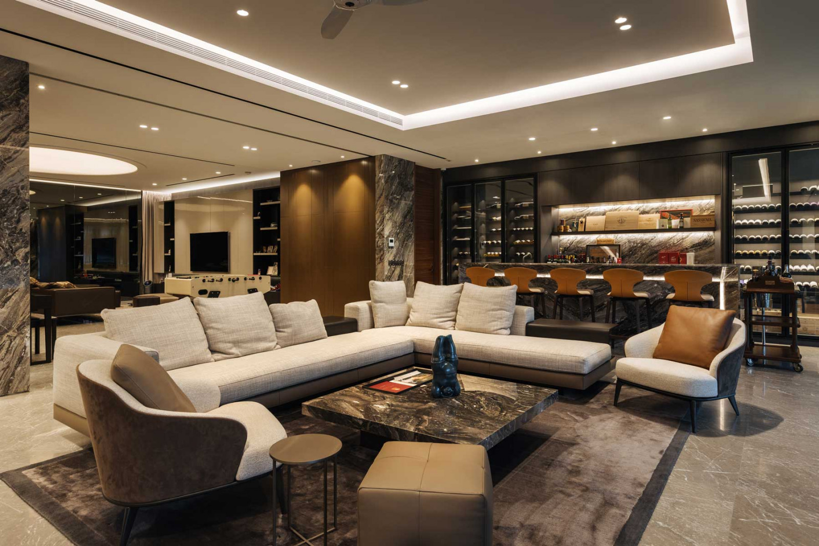 The social heart of The Stacked House is nestled in the basement, which opens up to the tennis lawn