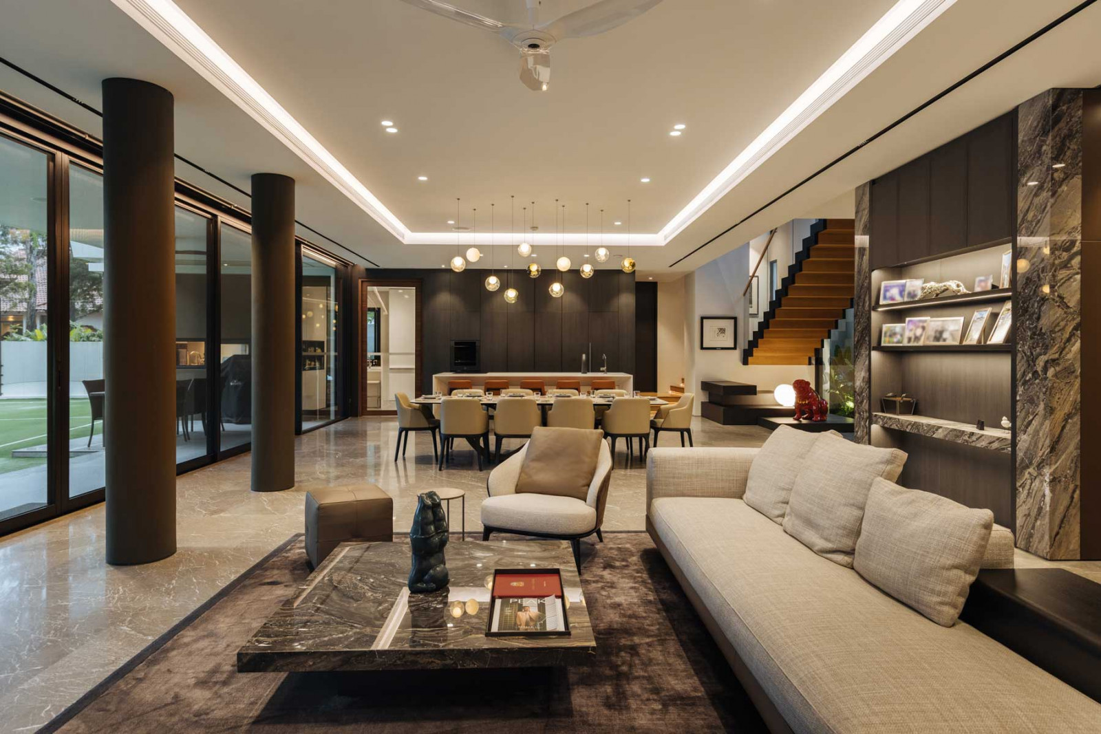 A view of the main living and dining areas, as well as the dry kitchen, located in the basement away from prying eyes