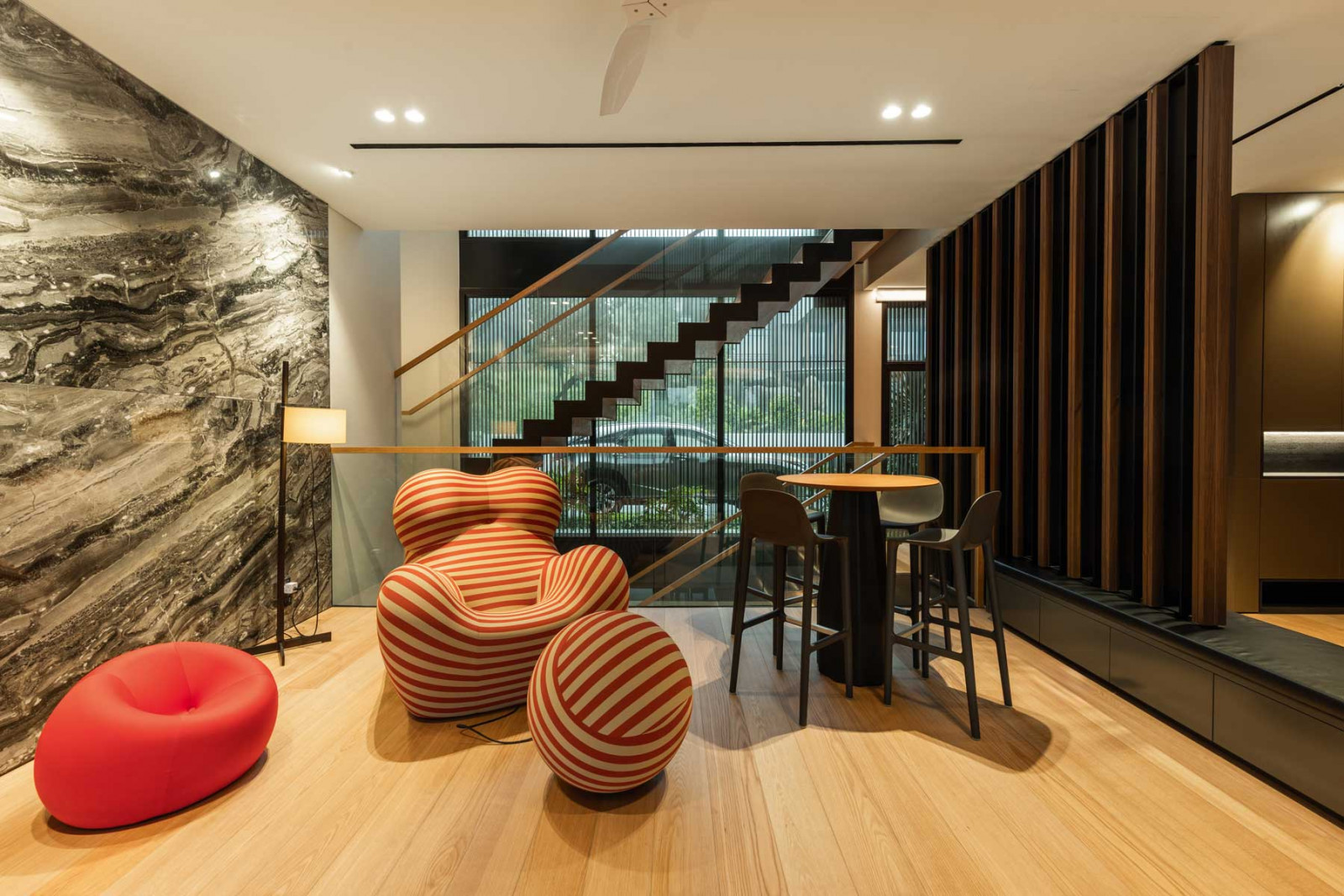 Timber panels line the cosy holding area that doubles as a pool bar