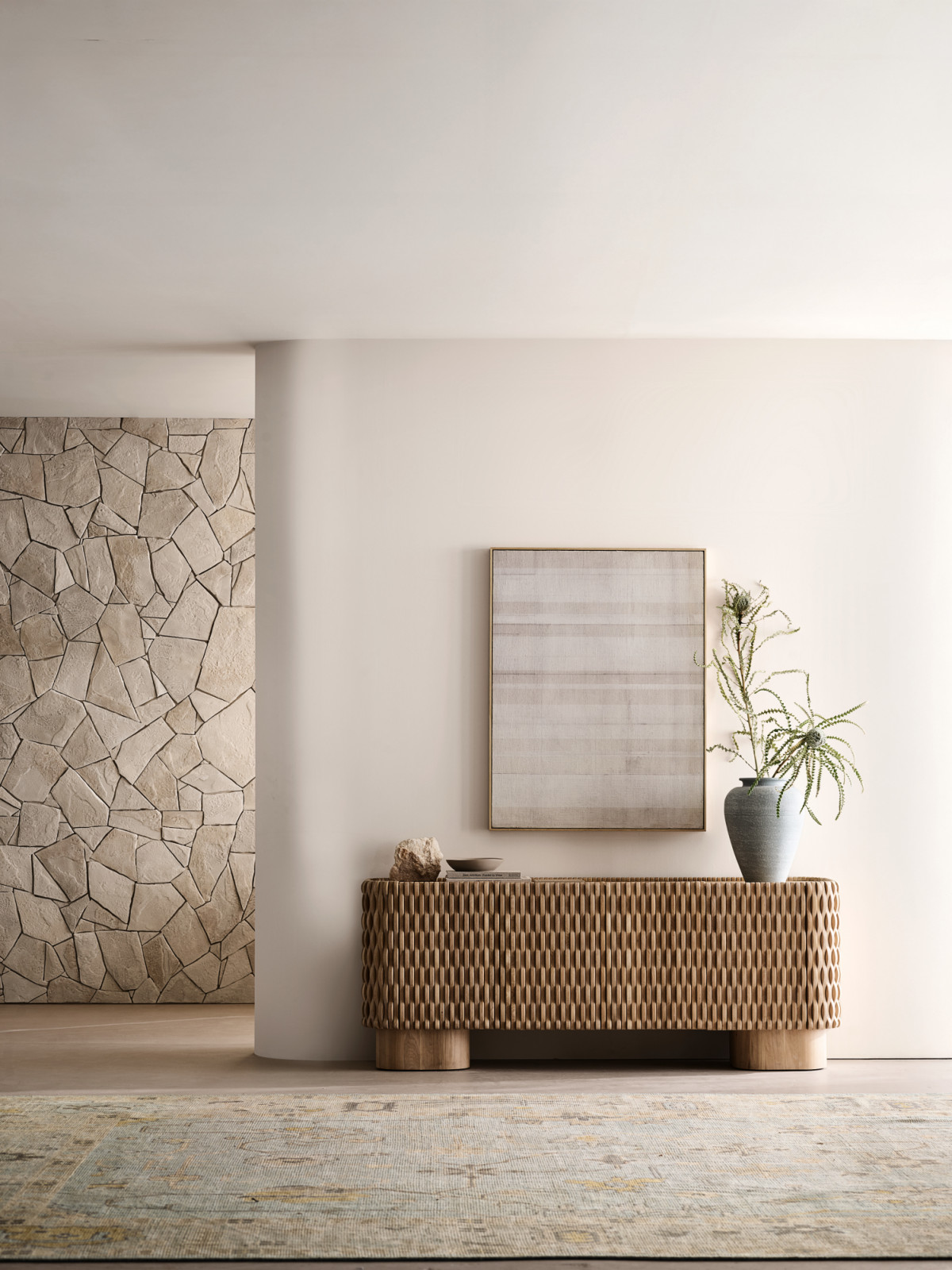 Bold forms and riveting texture make Esselen a real eye-turner. Set on large, rounded square legs, the media console features a seamless facade of alternating, undulating slats of hand-finished solid oak that give it the breezy look of ocean waves (Photo: courtesy of Crate and Barrel)