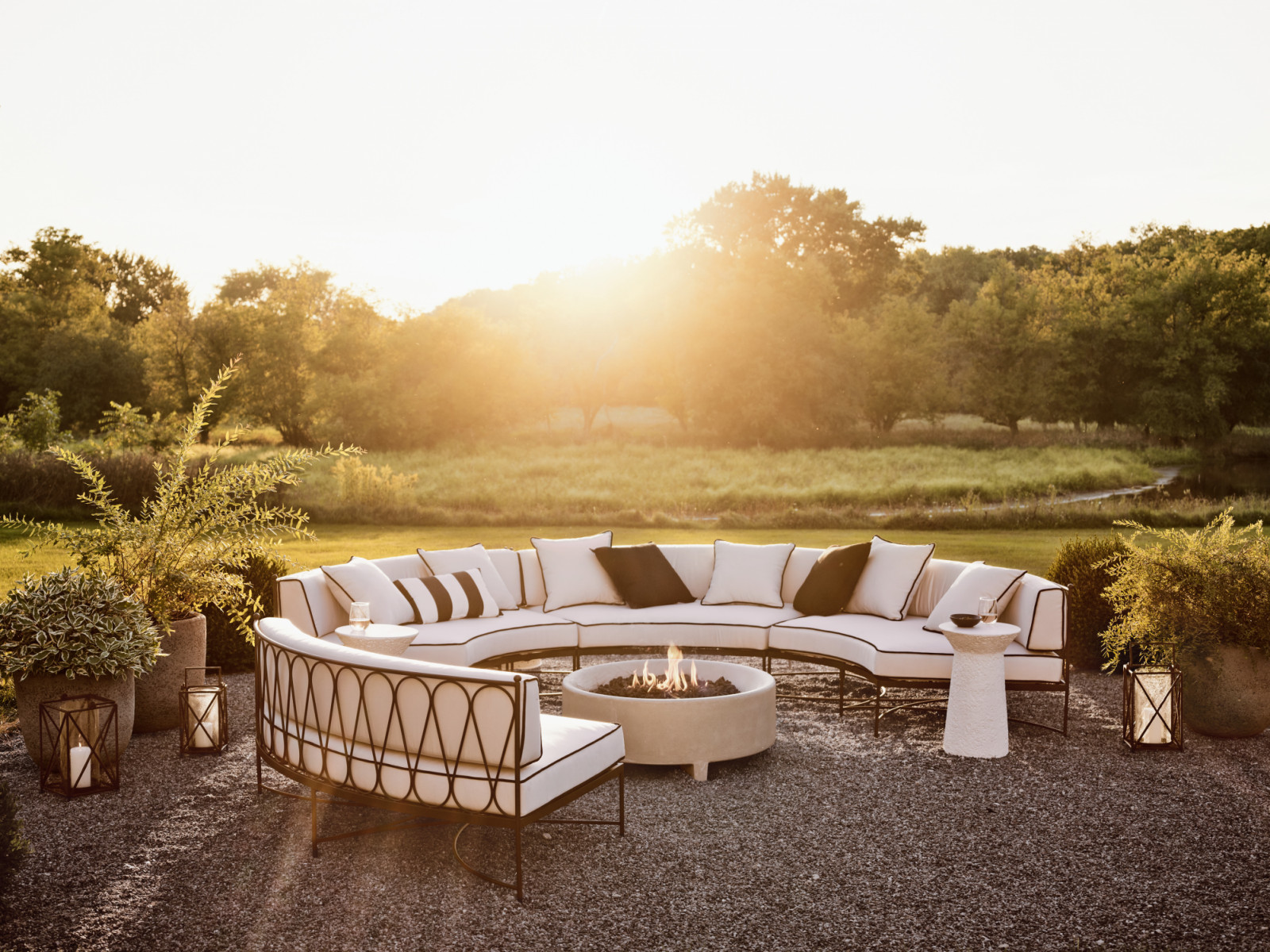 The Galleria outdoor sofa loops and curves, drawing on English garden style for a look that feels classic yet fresh. Finished in matte black, the stainless steel frame flows a rounded back inset with a ribbon of looped teardrops (Photo: courtesy of Crate and Barrel)
