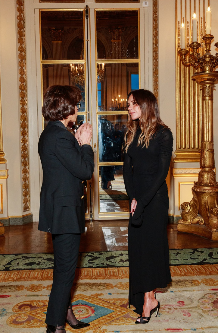 Victoria Beckham in a high-neck ruched black evening gown (Photo: @victoriabeckham/Instagram)