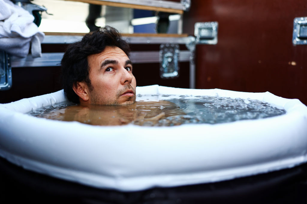 SINGAPORE, SINGAPORE - SEPTEMBER 17: Sergio Perez of Mexico and Oracle Red Bull Racing takes an ice bath prior to the F1 Grand Prix of Singapore at Marina Bay Street Circuit on September 17, 2023 in Singapore, Singapore. (Photo by Mark Thompson/Getty Images)