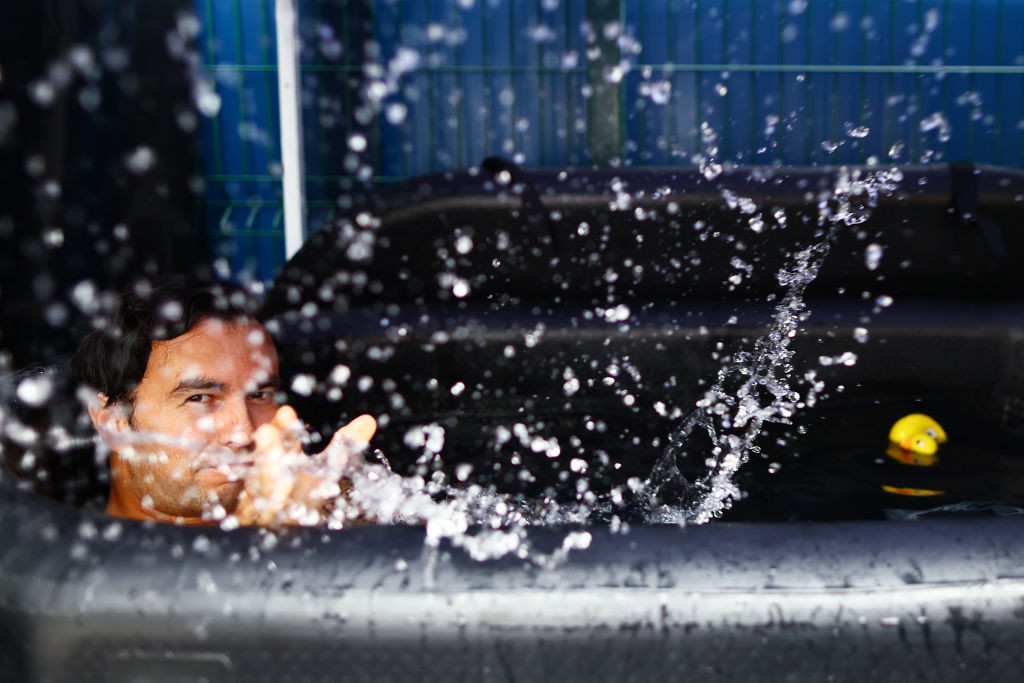 SINGAPORE, SINGAPORE - SEPTEMBER 21: Sergio Perez of Mexico and Oracle Red Bull Racing has a ice bath in the Paddock prior to final practice ahead of the F1 Grand Prix of Singapore at Marina Bay Street Circuit on September 21, 2024 in Singapore, Singapore. (Photo by Mark Thompson/Getty Images)