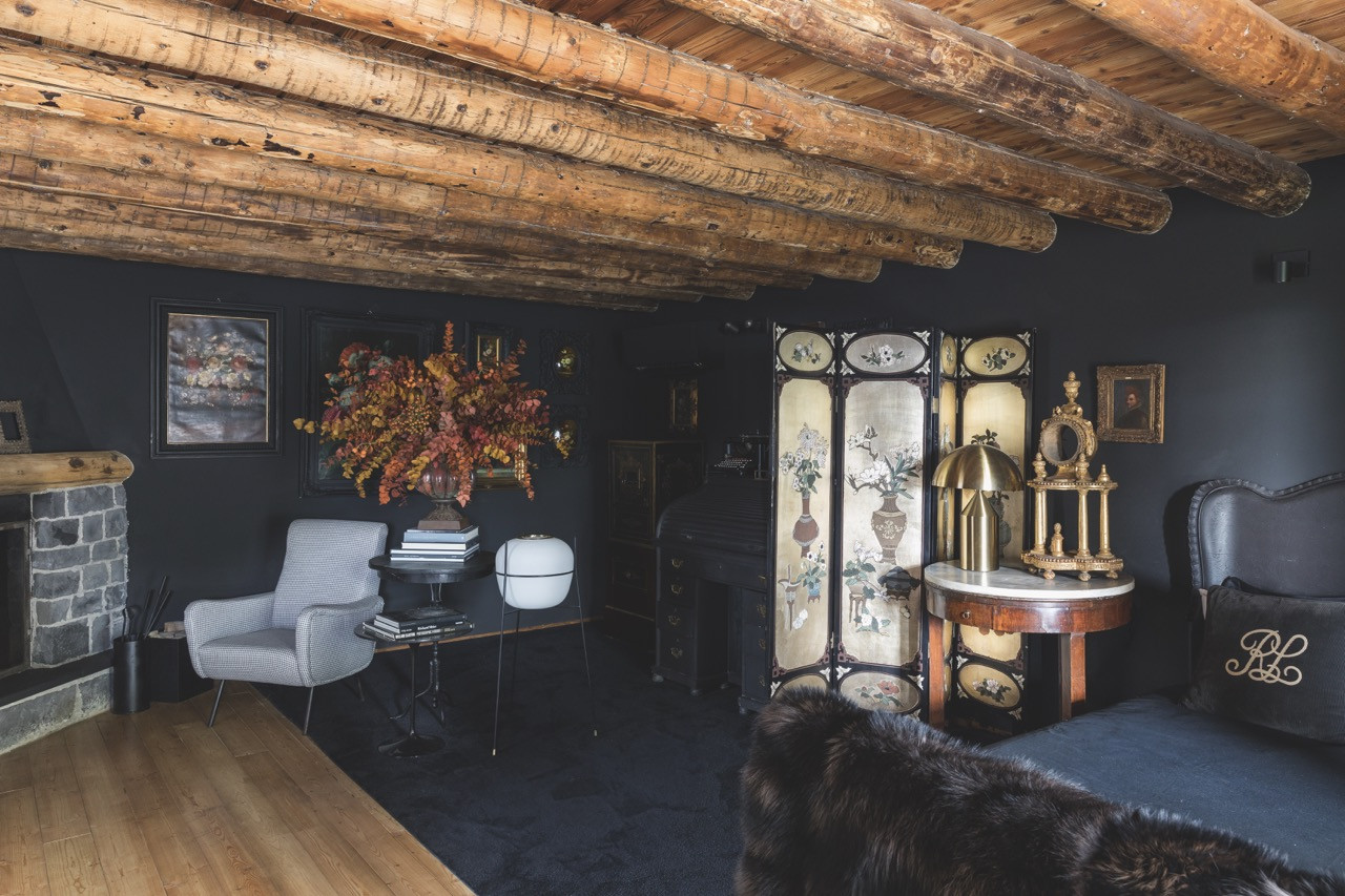 A full view of the master bedroom, which features exposed timber ceiling joists