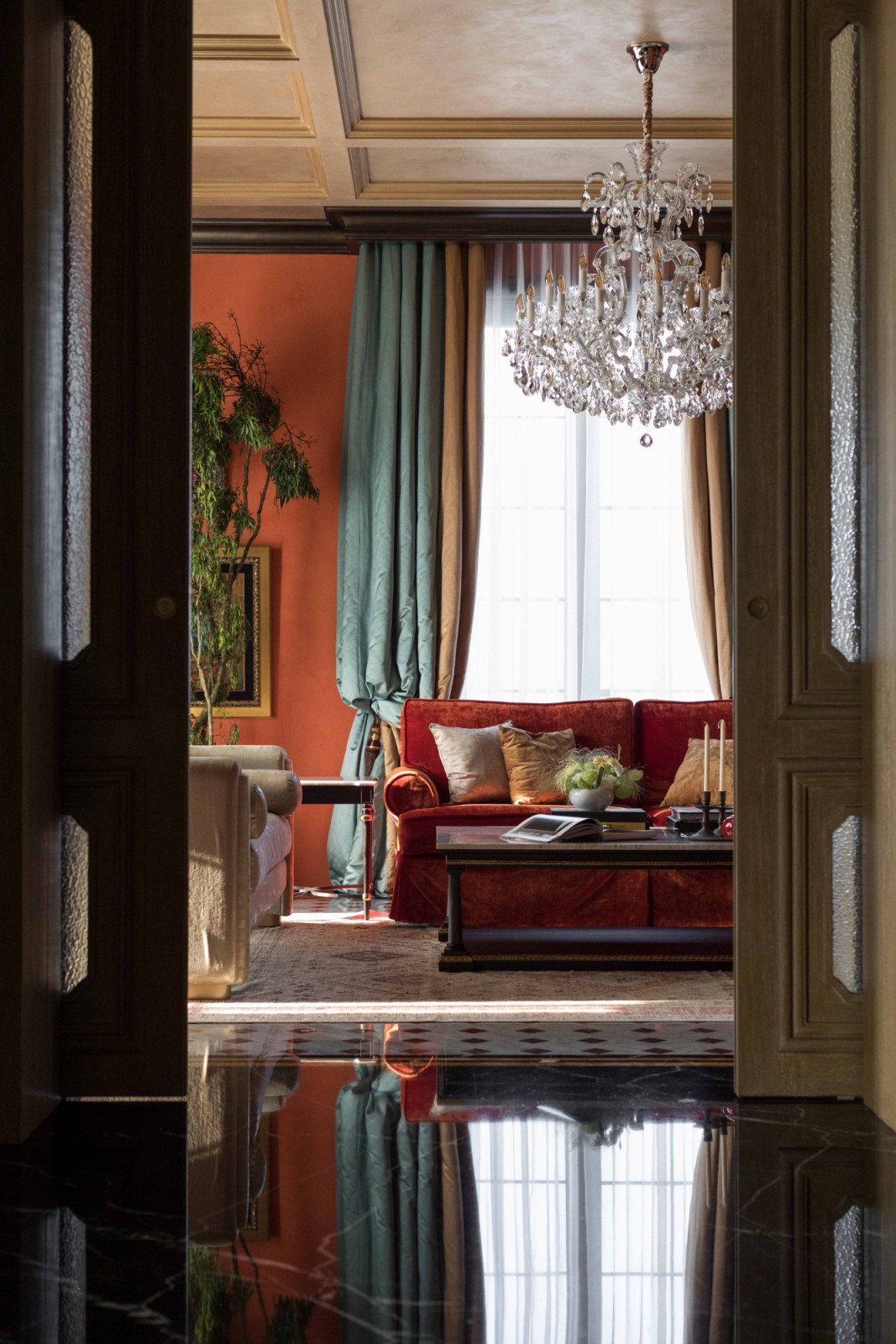 A vignette of orange and green brings a sense of freshness, viewed from the foyer at The Continental
