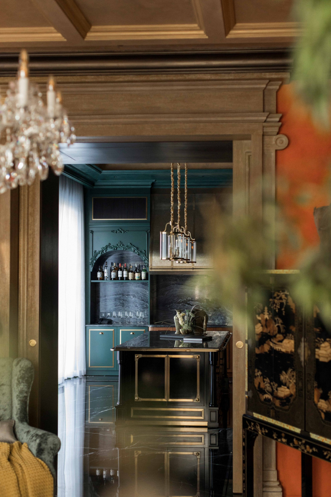 At The Continental, a framed view leads from the living room into the kitchen