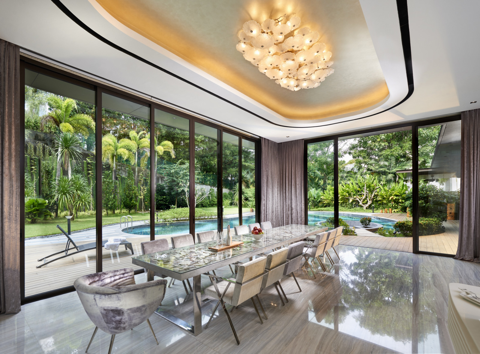 The spacious dining area looks out to the pool