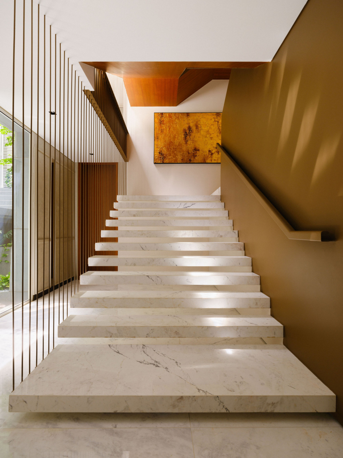 Dappled sunlight falls on these floating stairs