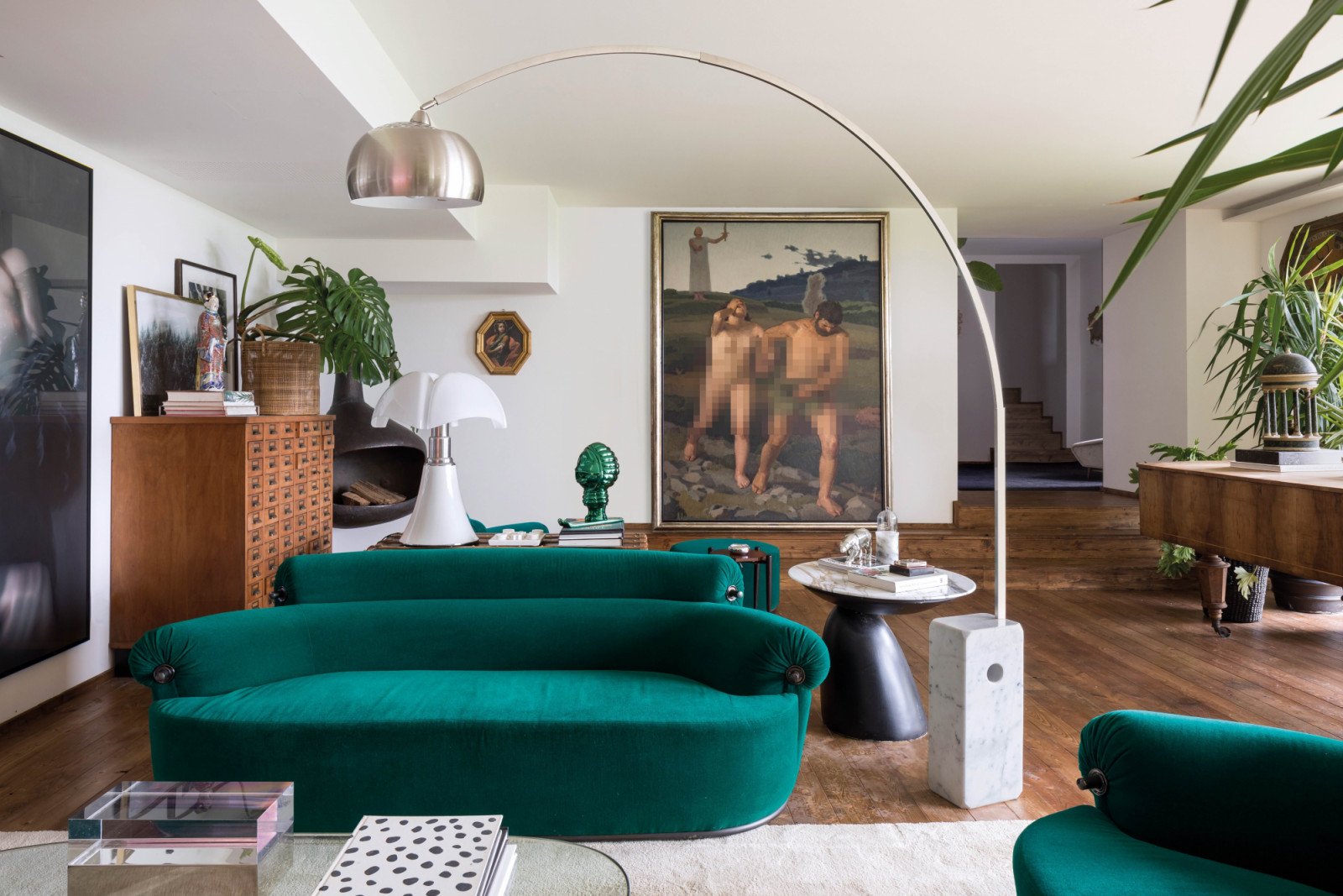 Luigi Caccia Dominioni’s striking P20B Toro sofa for Azucena stands
in front of Francesco Conti’s 18th-century painting of a female figure on an octagonal panel, alongside a 1940s office cabinet, Augusto Colombo’s 1936 painting The Expulsion of Adam and Eve, and Gae Aulenti’s Pipistrello lamp for Martinelli Luce