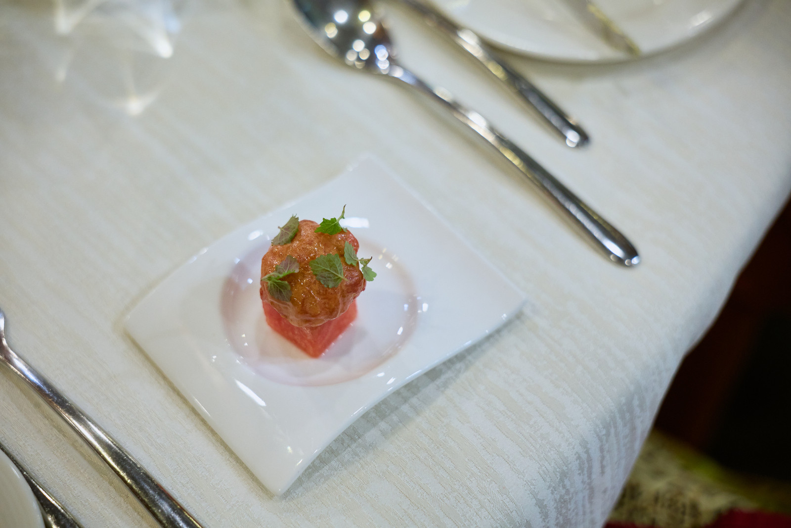 Amuse-bouche under the guidance of Chef Hans: Watermelon & Tuna Tartare with Laksa Dressing and Acidic Herbs