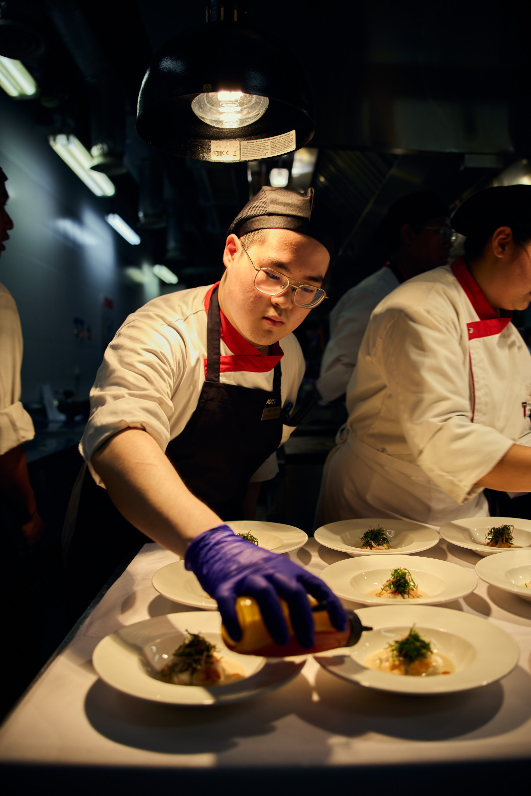 Wynn Wyman in the midst of preparing the starter course for an intimate group of guests