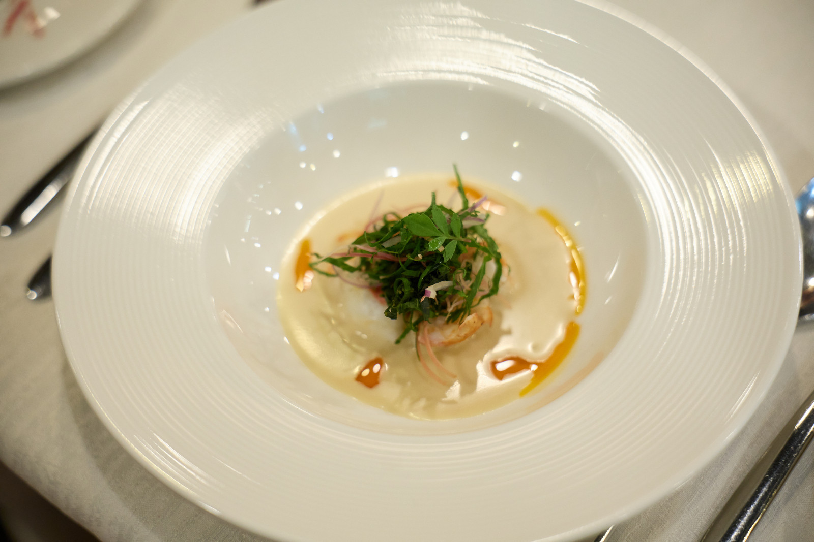 Starter under the guidance of Chef Yuda: Lobster Ulam, Poached Lobster, Wild Herb Medley (Pegaga, Kemangi, Mint) with Coconut-Lime Dressing and Sambal Belacan Oil