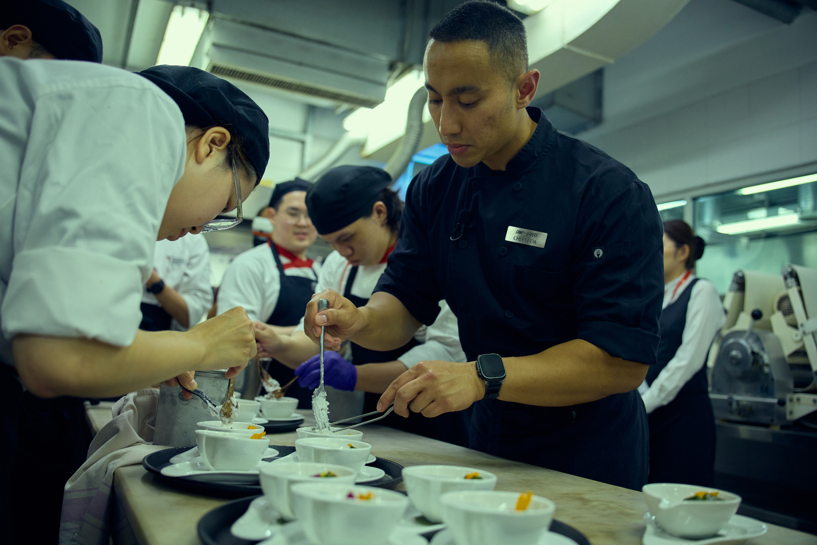 Show, don’t tell: Chef Yuda preparing desserts alongside the students as they replicated his technique