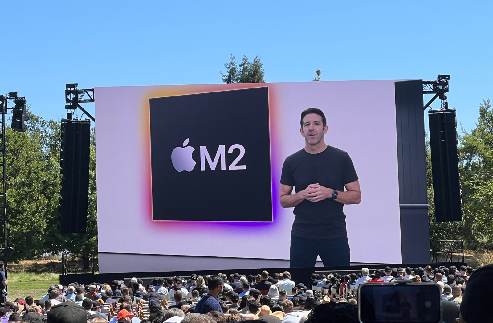 06 June 2022, US, Cupertino: John Ternus, Apple Senior Vice President of Hardware Engineering, introduces the new M2 microprocessor at Apple's WWDC 2022 developer conference at the company's headquarters, Apple Park, in Cupertino. The chip system is said to offer more performance than Apple's first M1 chip, even with the same power consumption. Among other things, the M2 has a quarter more transistors. Photo: Christoph Dernbach/dpa (Photo by Christoph Dernbach/picture alliance via Getty Images)