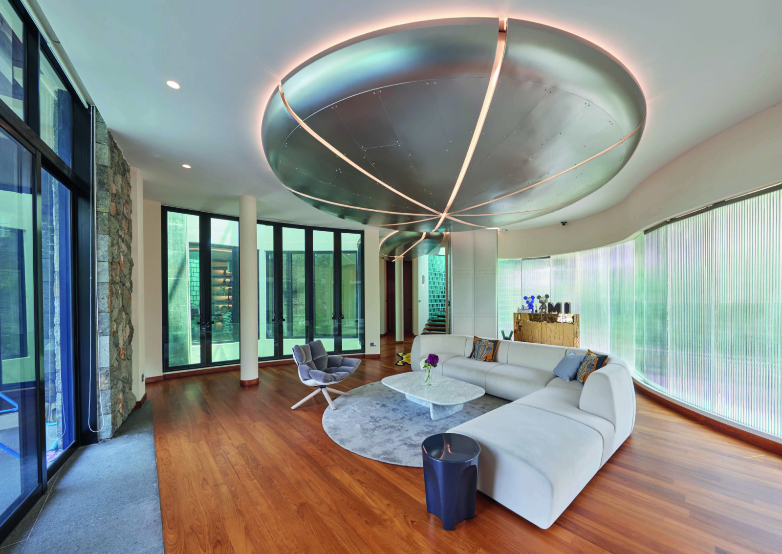 Pieces from B&B Italia and Edra complement the ceiling aluminium installation called the Orange in this living room