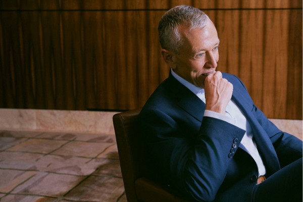 Richard Ditizio wearing a business suit, seated for an exclusive portrait with Tatler Asia at the Four Seasons Hong Kong, March 2026. (Photo by Ken Leung for Tatler Asia)