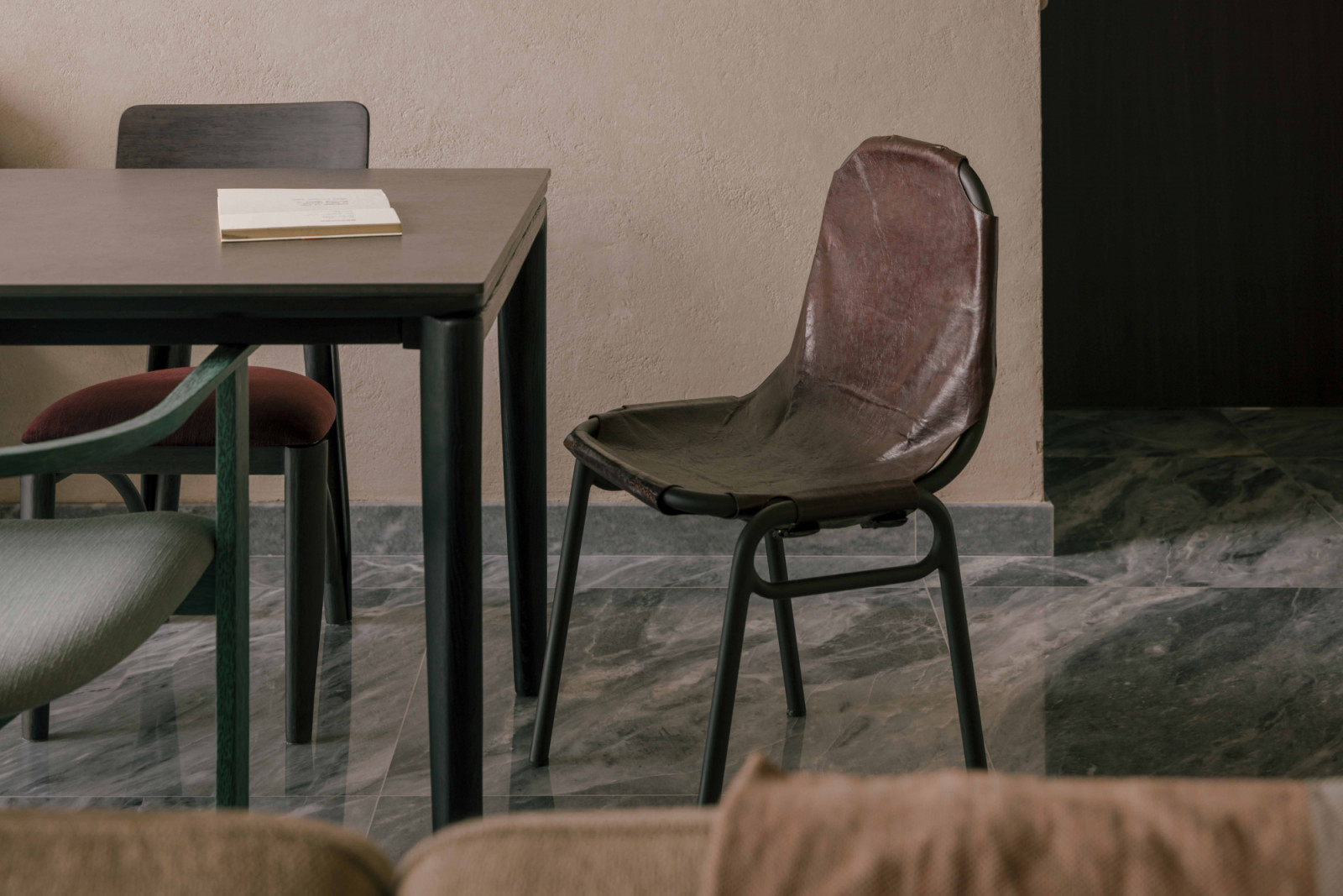 A closer look at the coffee leather chair prototype by Goy Architects