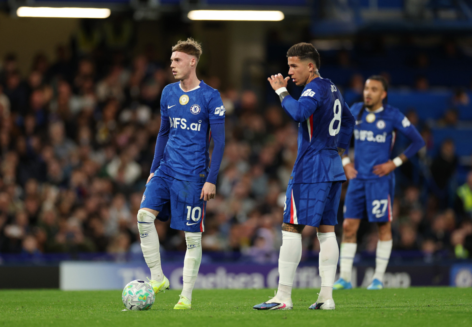 LONDON, ENGLAND - APRIL 18: Cole Palmer talks with teammate Enzo Fernandez during the Premier League match between Chelsea and Manchester United at Stamford Bridge on April 18, 2026 in London, England. (Photo by Chelsea Football Club/Chelsea FC via Getty Images)