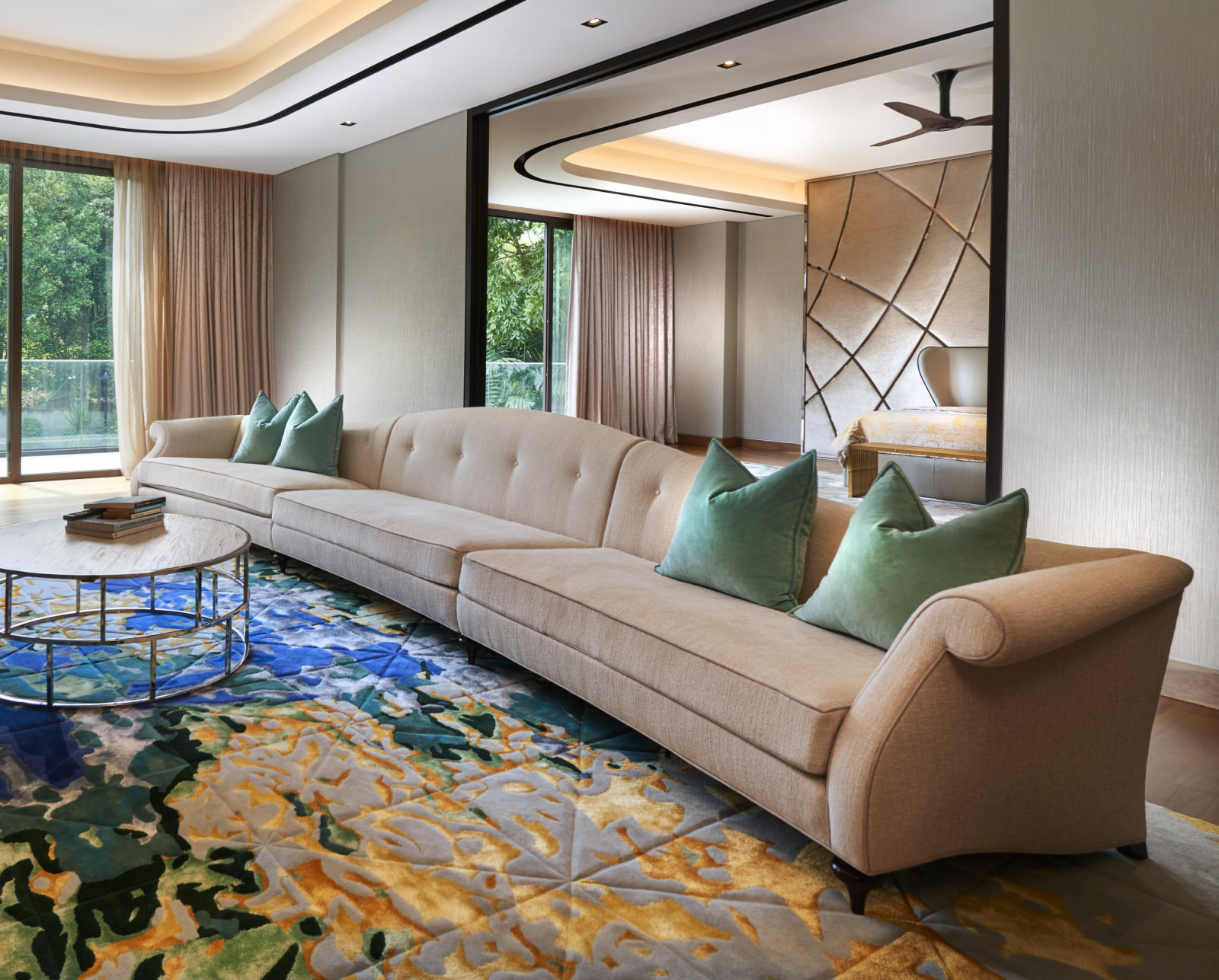 Christopher Guy’s expansive, modular sofa with deep, plush cushions, offering sleek comfort for the family in the lounge of the master suite