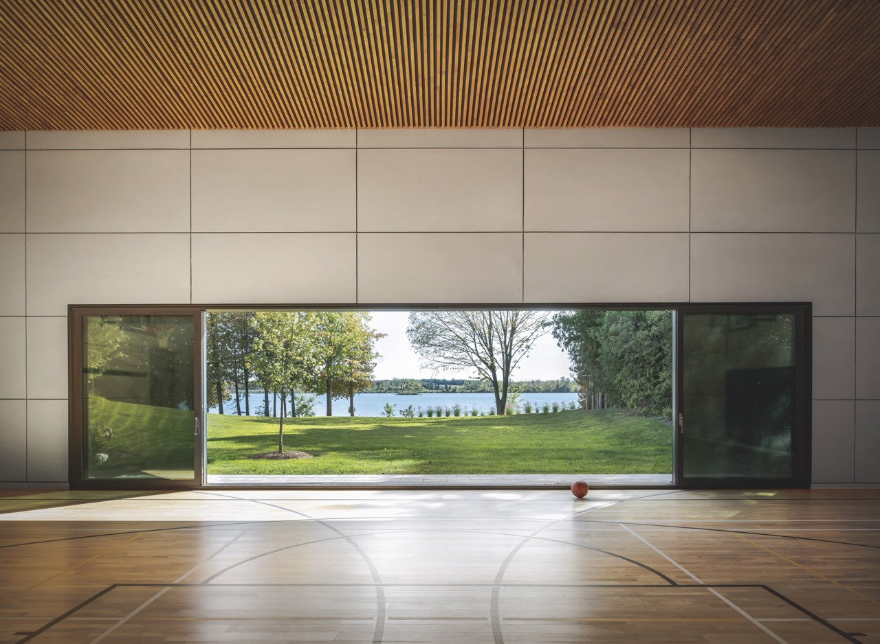 The gym’s large doors ensure unhindered views and plenty of natural light, supporting both physical and mental wellness