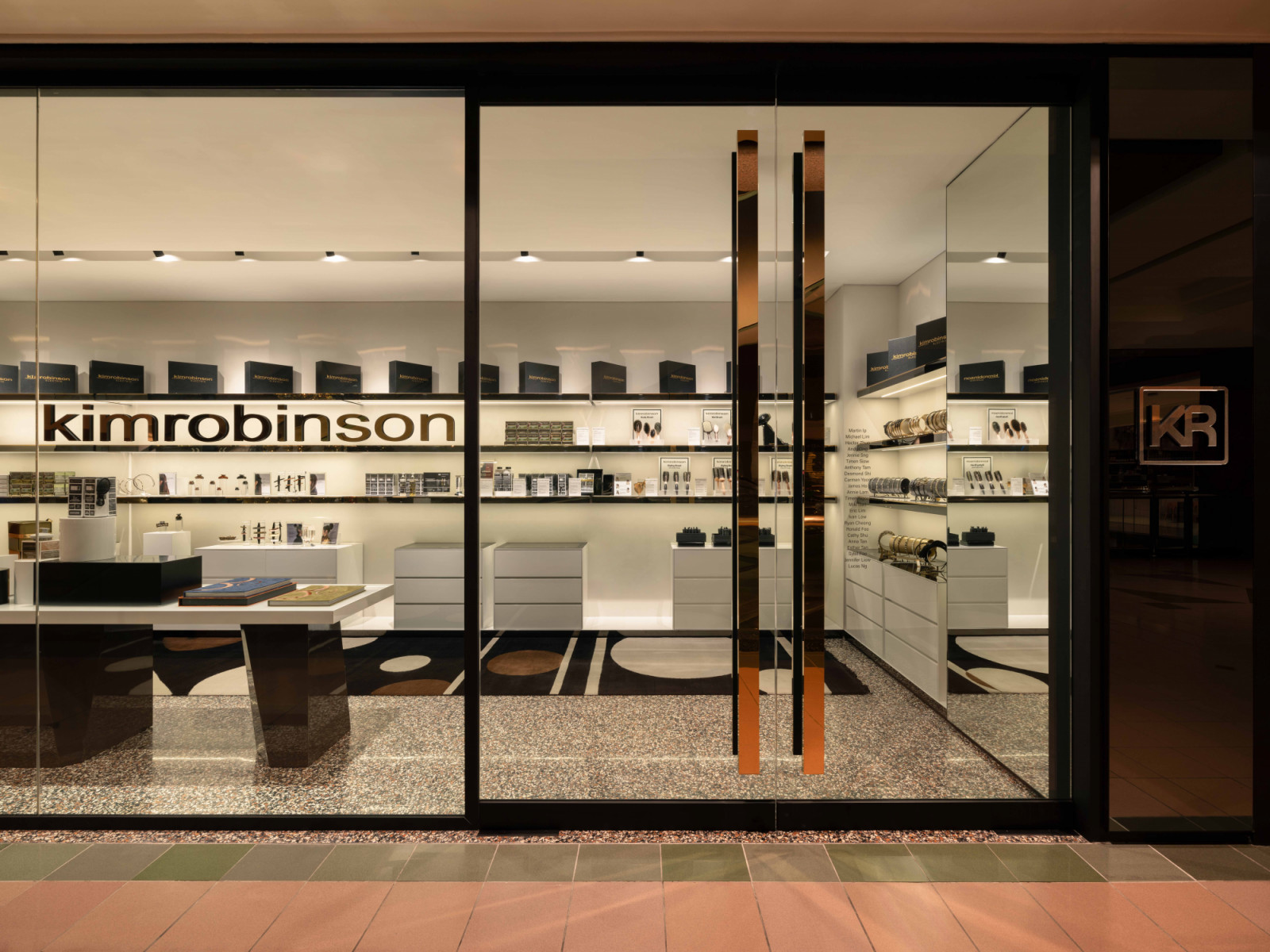 The brightly lit facade of the Kim Robinson salon