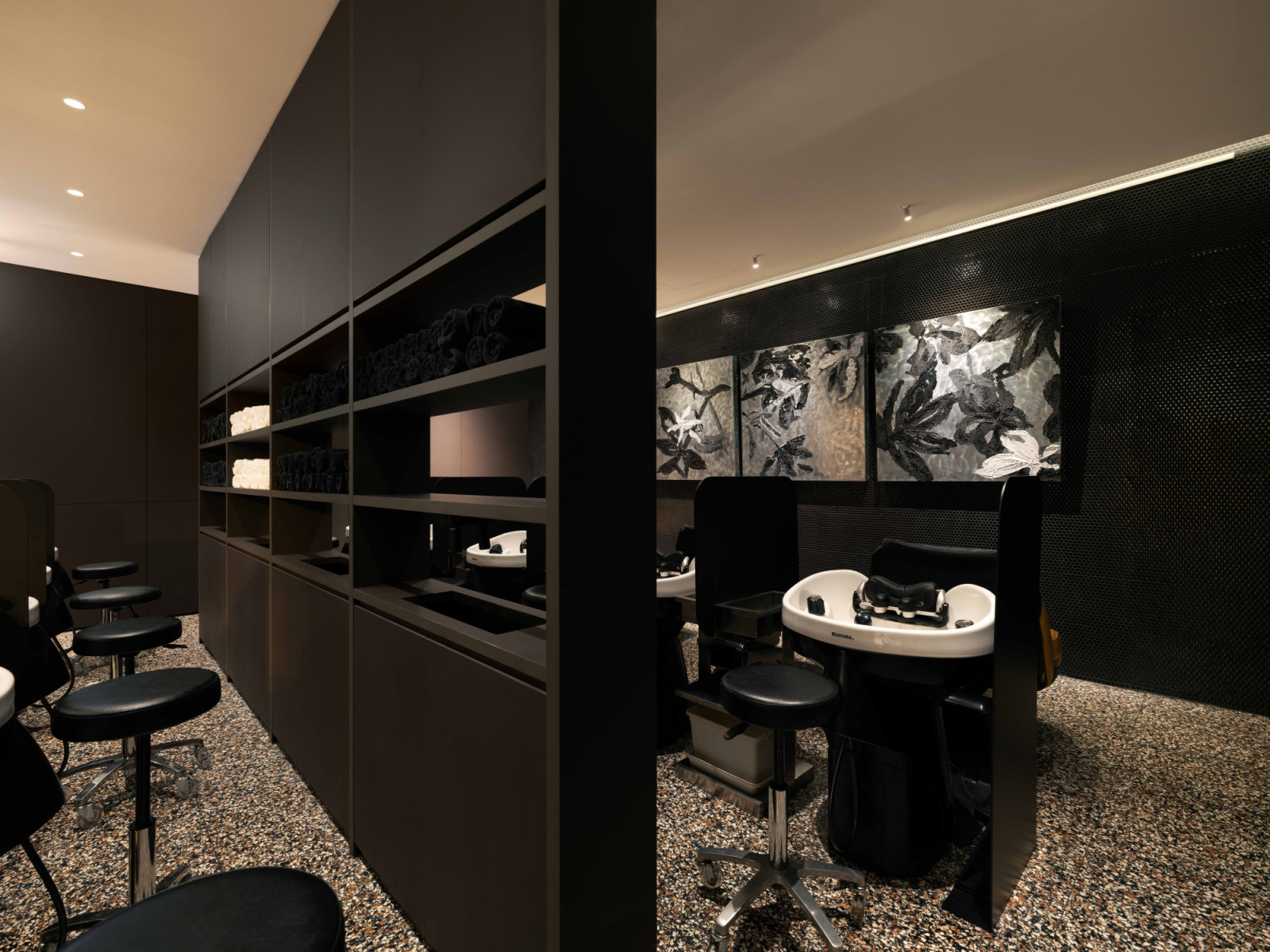 The hair wash stations are tucked away from the rest of the salon to give clients privacy