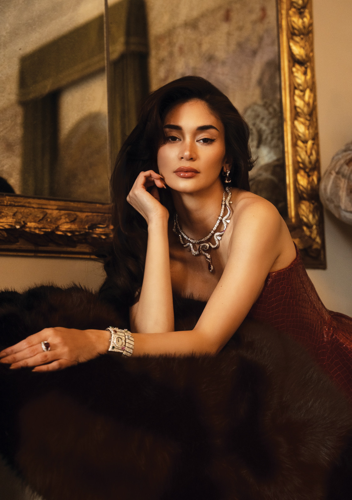 Pia dons a Georges Hobeika corset top and skirt, Christian Louboutin heels accented with Bvlgari High Jewellery and watch
