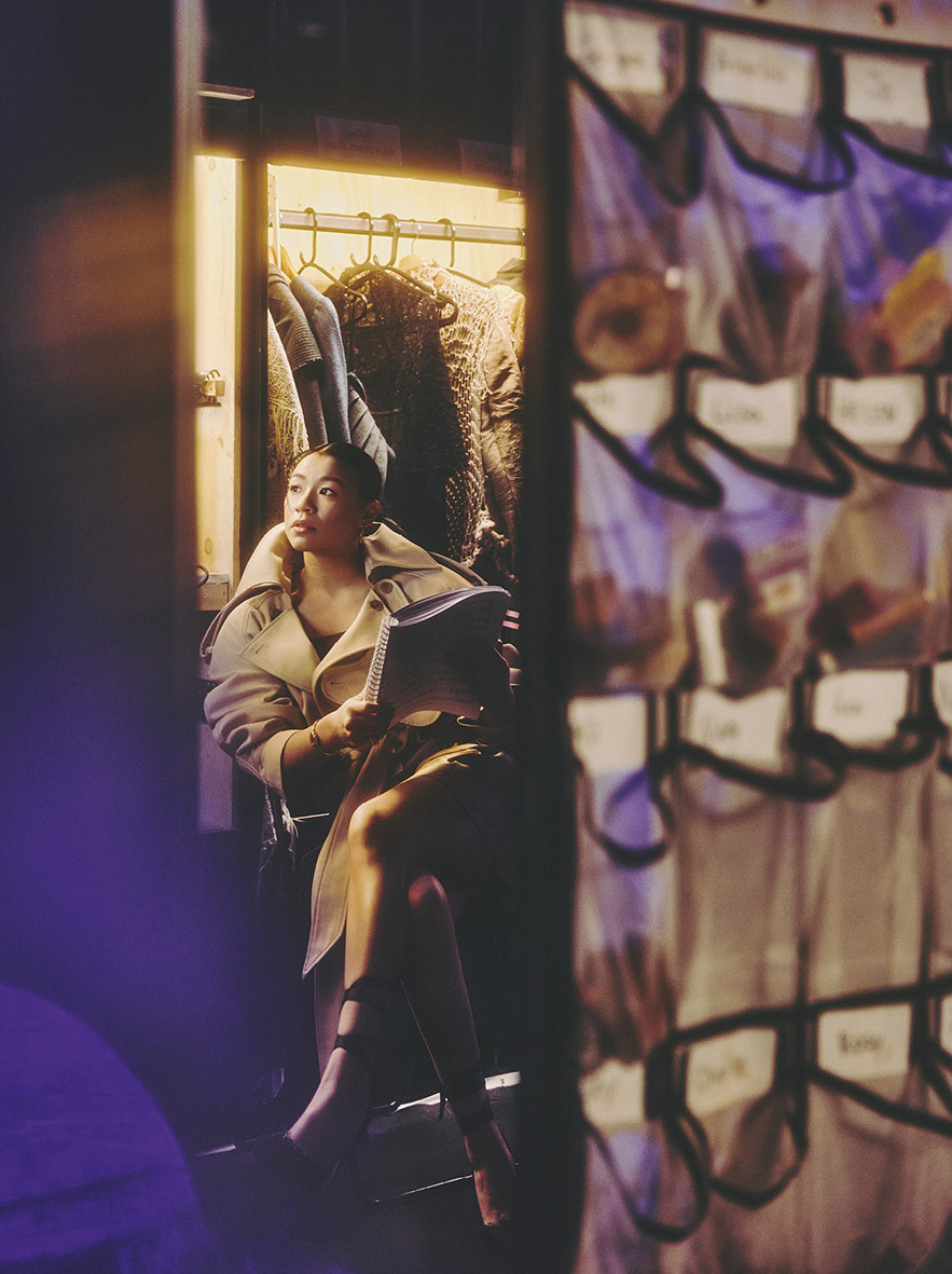 Theunissen at enVie de Pois trench coat; Dice Kayek at enVie de Pois shorts; Cartier Clash de Cartier earring and rings in rose gold, Baignoire watch in yellow gold set with diamonds; Christian Louboutin Cassia lace-ups; stylist’s own camisole, barrette