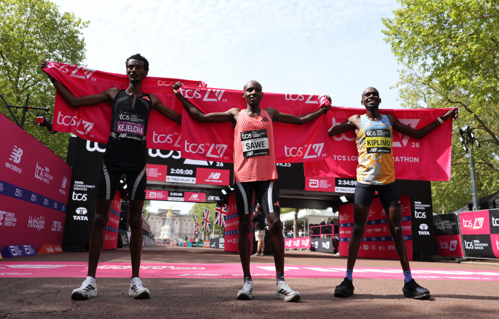 LONDON, ENGLAND - APRIL 26: 1st placed Sabastian Sawe of Team Kenya (C), 2nd placed Yomif Kejelcha of Team Ethiopia (L) and 3rd placed Jacob Kiplimo of Team Uganda (R) pose for a photo after the Men’s 2026 TCS London Marathon on April 26, 2026 in London, England. (Photo by Alex Davidson/Getty Images)
