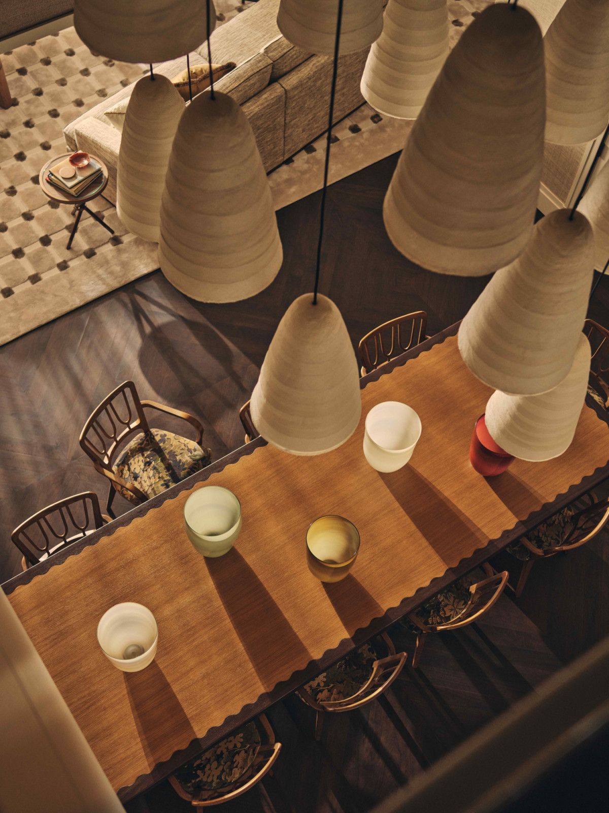The bespoke three-metre oak and walnut table with subtle scalloped detailing along its edges