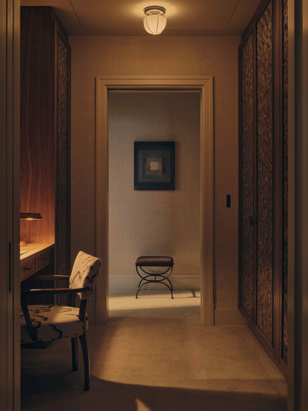 The key artwork in the principal dressing room reveals itself as a framed vista