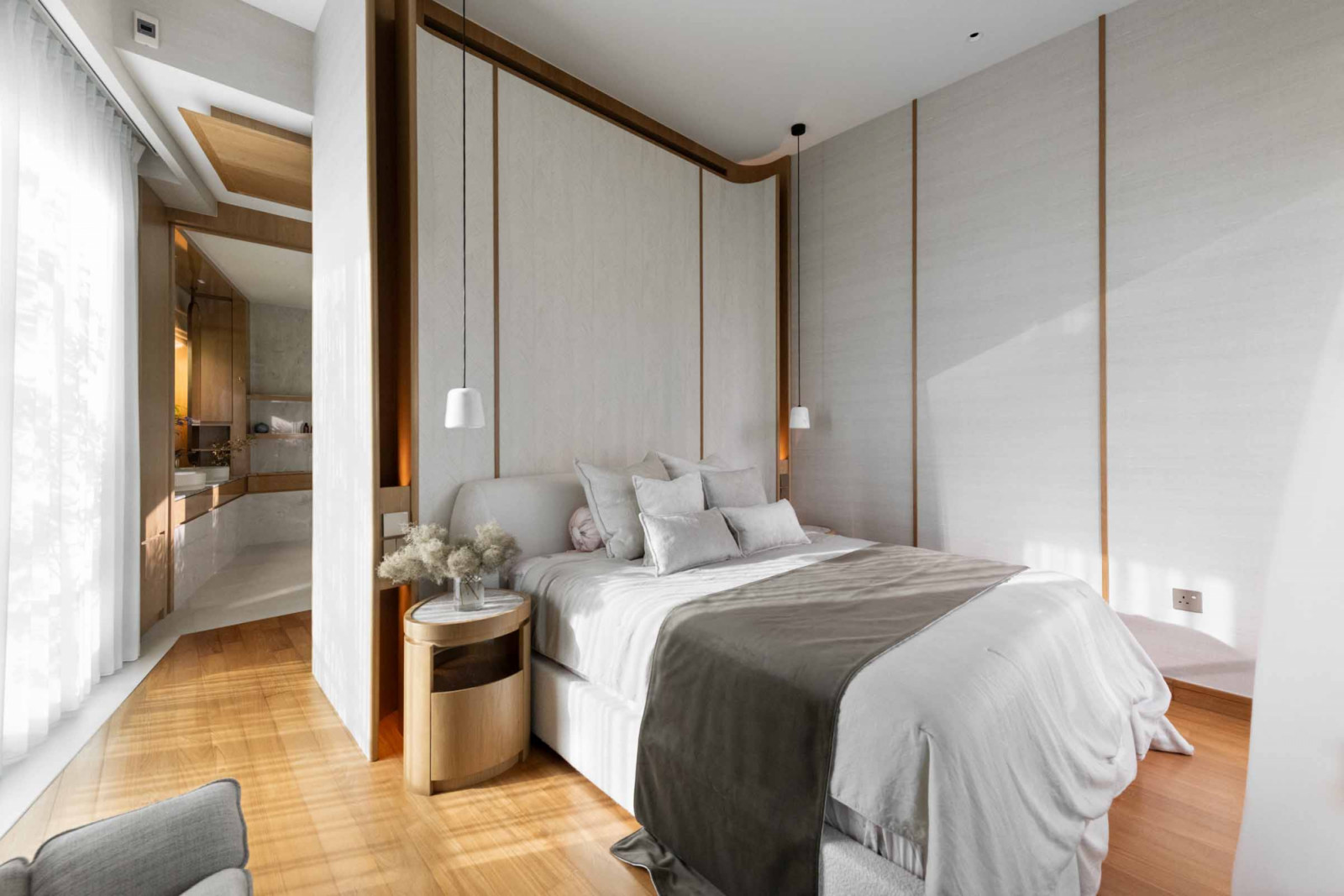 This bedroom is kept neutral, with soft greys and whites working in tandem to create a tranquil air