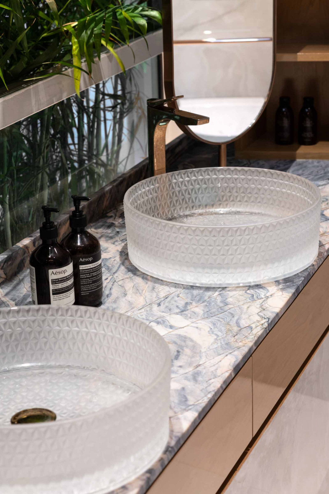 A closer look at the frosted his-and-hers basins