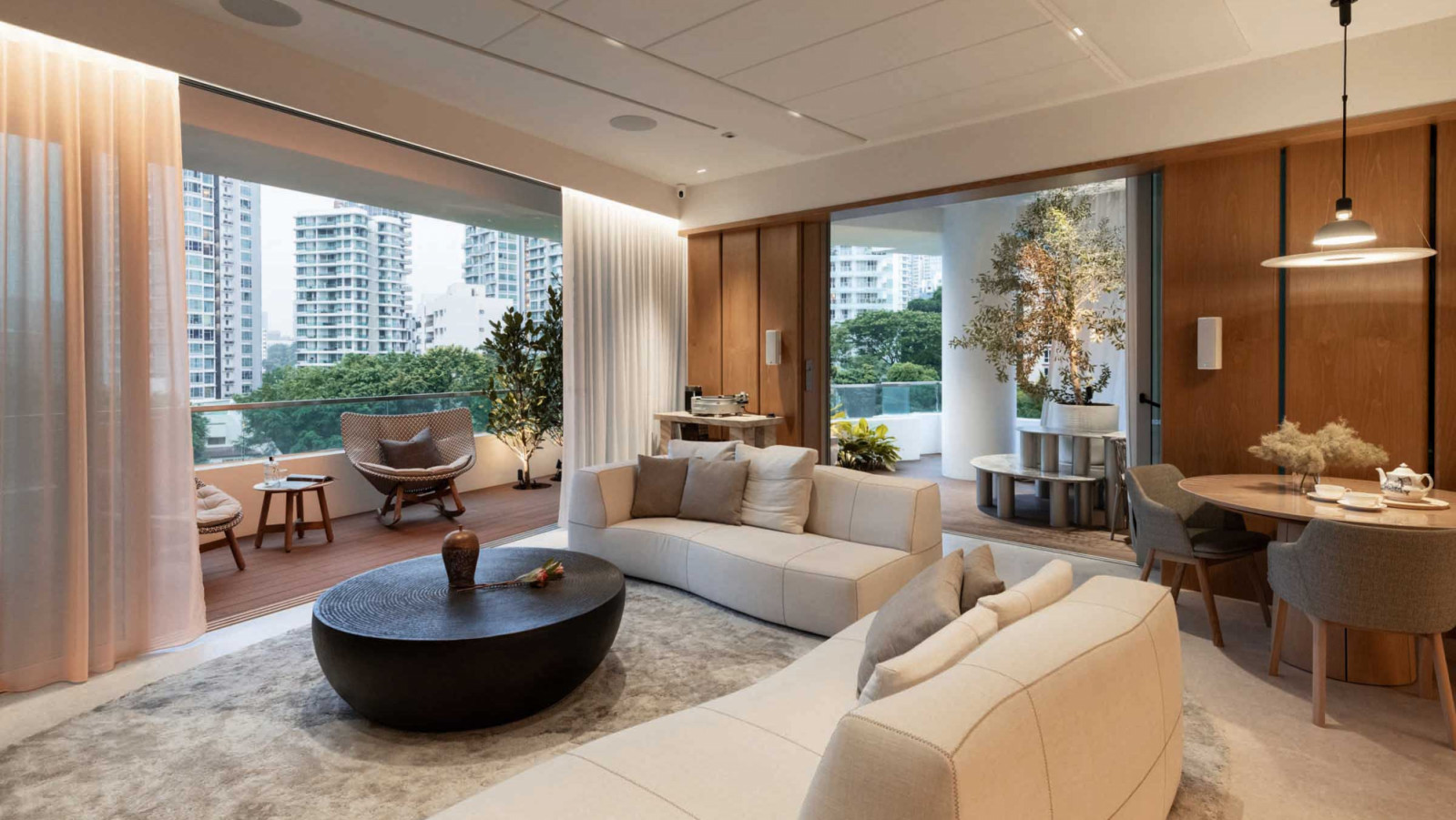 This Grange Infinite apartment by Architology Interiors balances the hi-tech needs of an audiophile with the openness of a sky high pavilion anchored by a striking olive tree