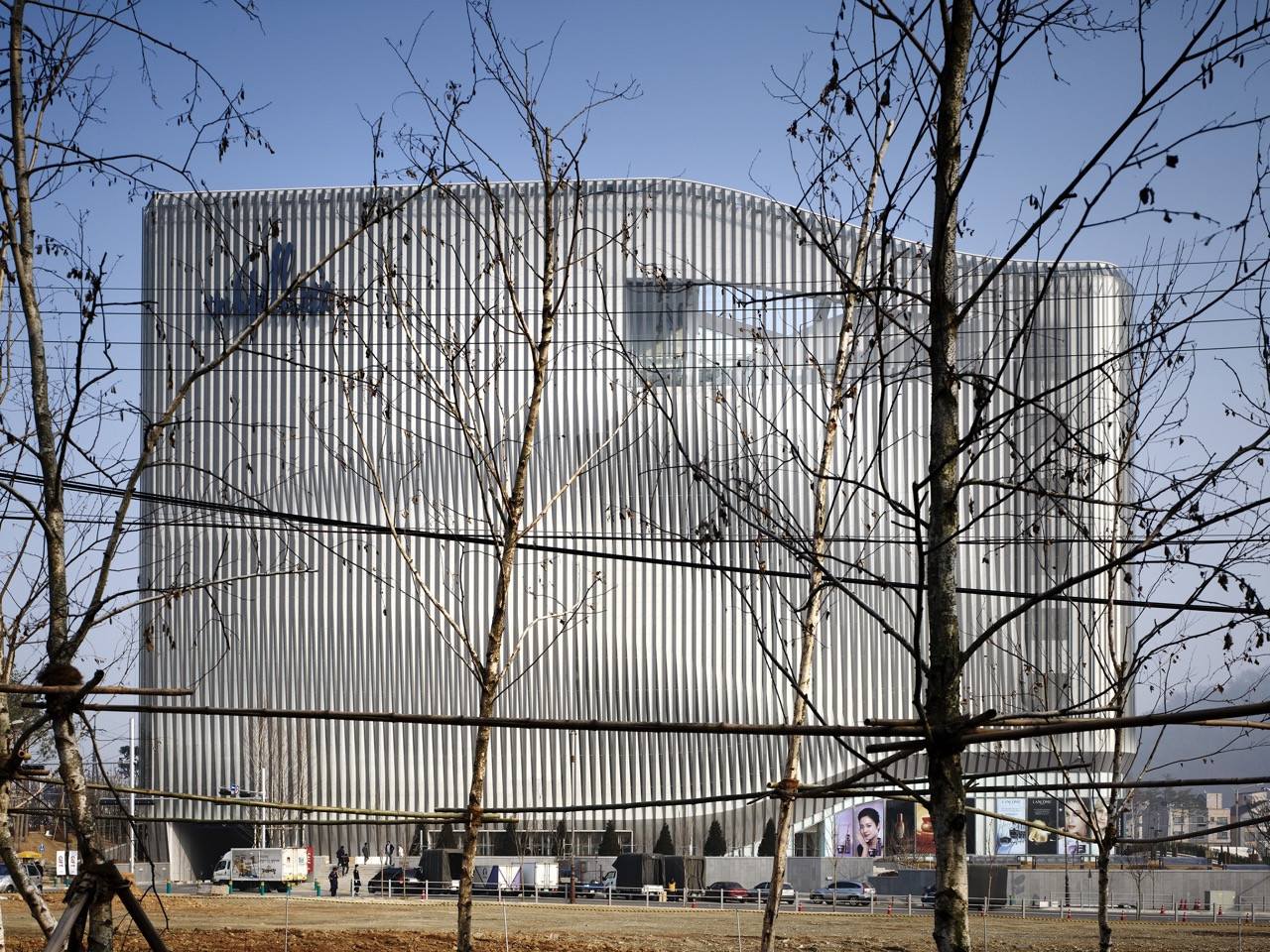 The exterior of Galleria Centercity in Cheonan, designed by UNStudio and completed in 2010, is clad in a double-layered aluminium façade of vertical mullions that skews the perceived scale of the 66,700-square-metre building (Photo: Getty)