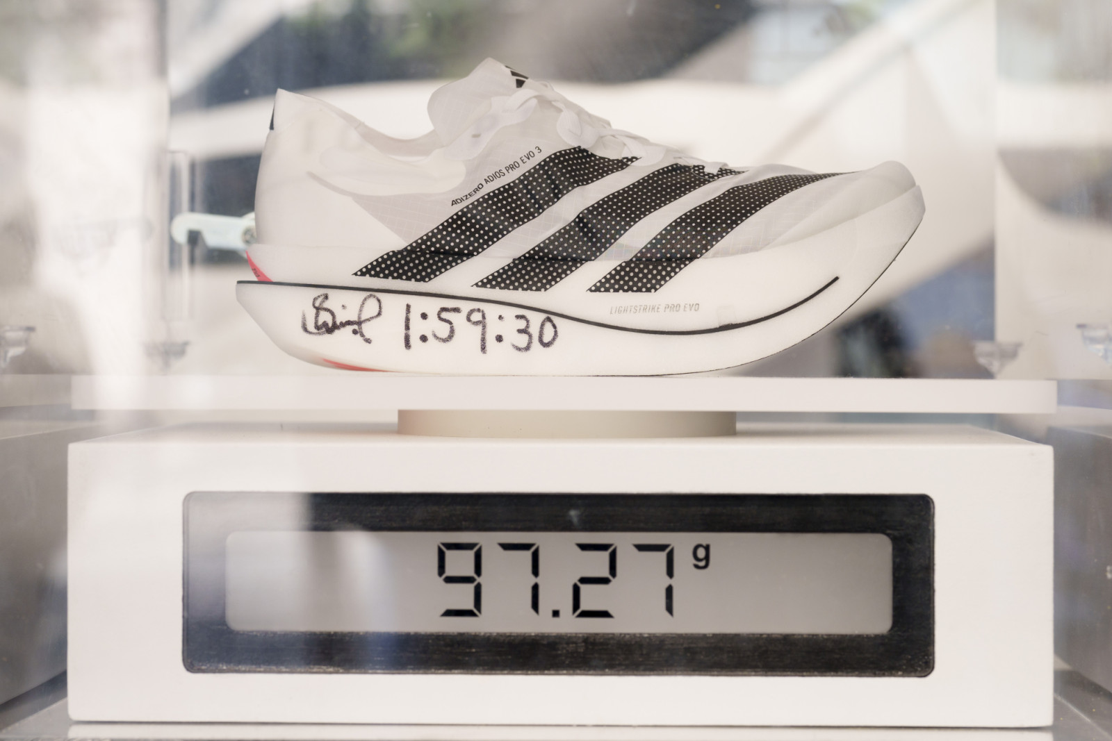 The morning after Kenyan runner Sabastian Sawe won the London Marathon with a world record time of 1:59.30, the first-ever sub-two-hour marathon in a competitive race, one of Sawe's autographed Adidas Adizero Adios Pro Evo 3 shoes is displayed at the Adidas store in London's Oxford Street, on 27th April 2026, in London, England. Sawe was the first to beat the iconic 2hr barrier but in second place, and also under two hours, came the Ethiopian Yomif Kejelcha in his forst ever marathon. Both wore the Adidas A
