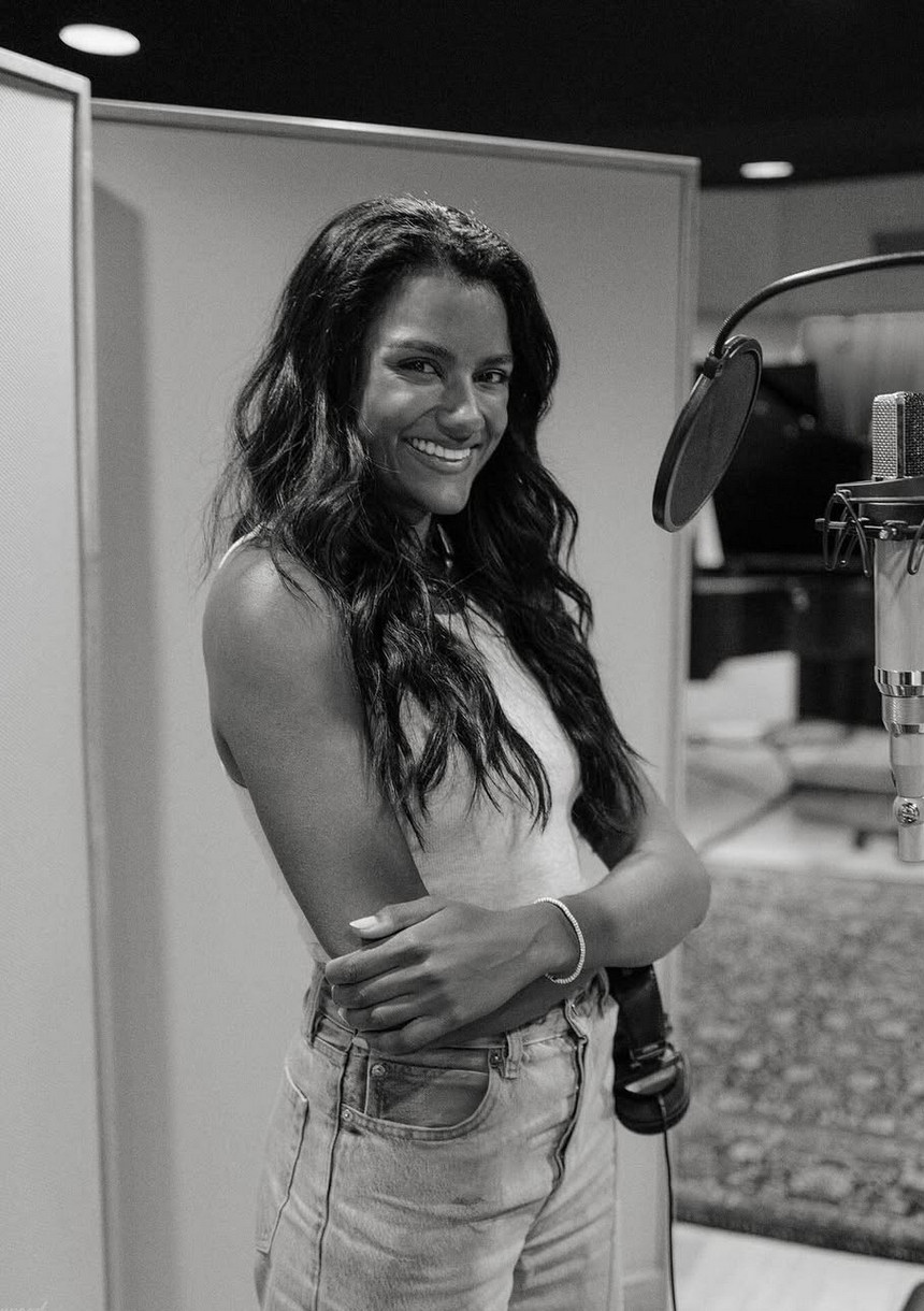 Simone Ashley proves the power of a fitted white tank and vintage-wash denim in the studio (Photo: @simoneashley/Instagram)