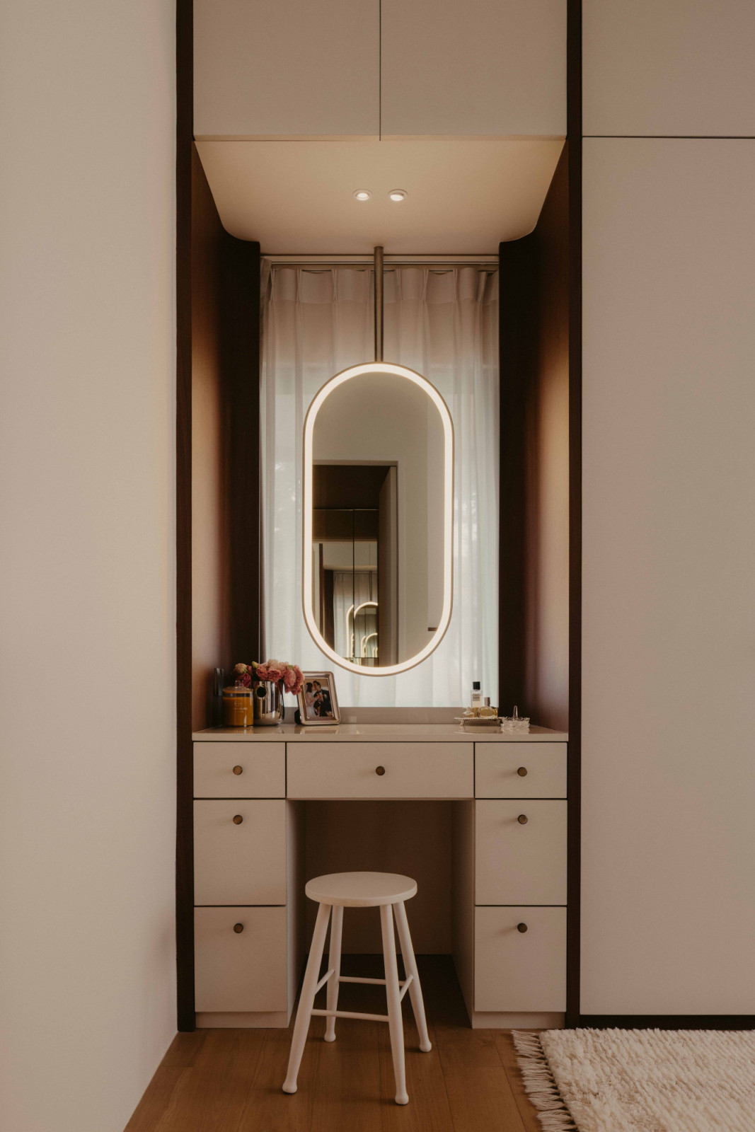The master the powder room pairs arching ceiling and microcement walls with a Dekton by Cosentino countertop