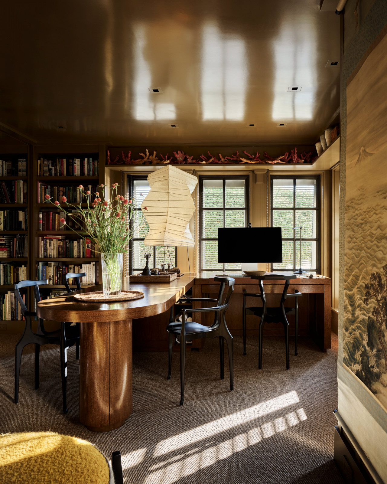 The custom desk designed by Wiseman anchors the home office on the lower level